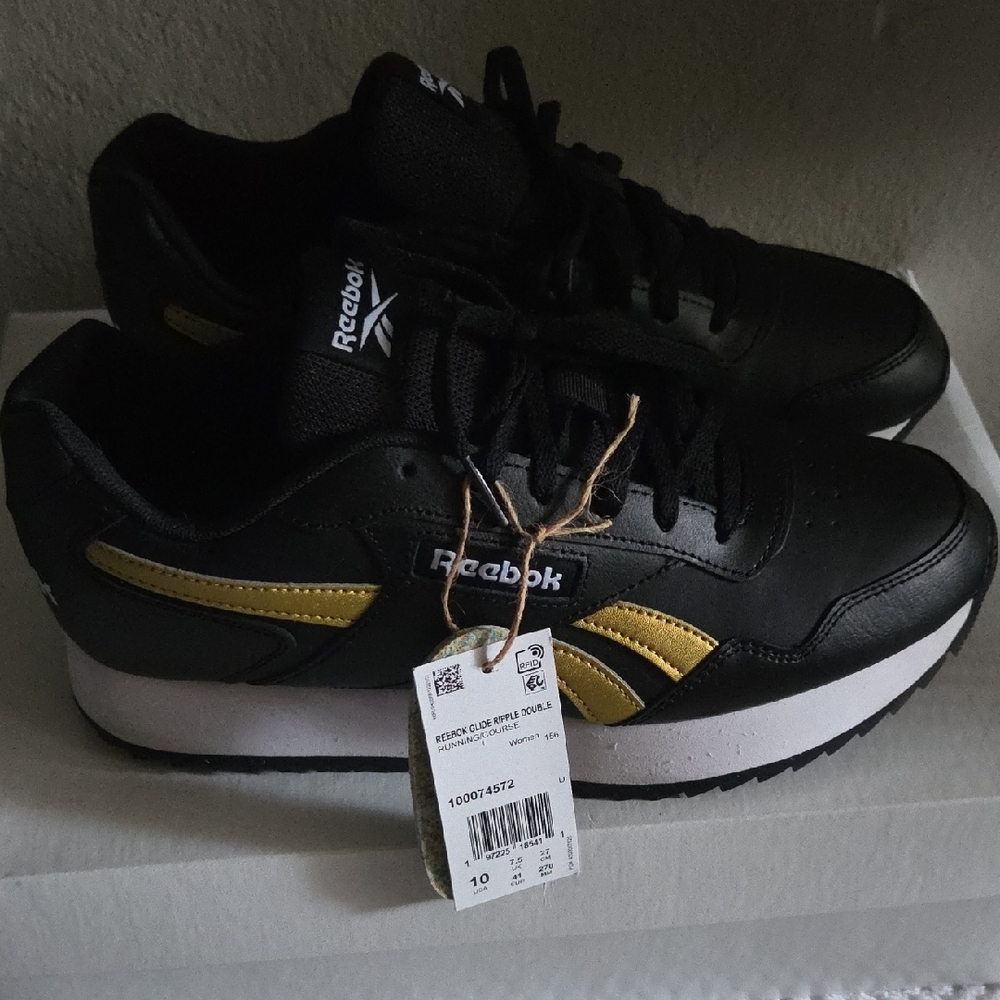 Reebok Black Sneakers with Gold Highlights